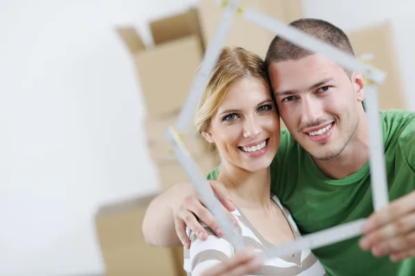 depositphotos_10649834-stock-photo-young-couple-moving-in-new