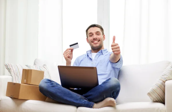 depositphotos_99546530-stock-photo-man-with-laptop-and-credit